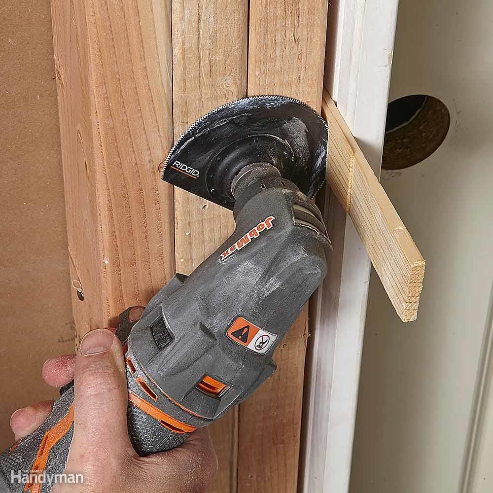 Trim wooden door shims with an oscillating tool