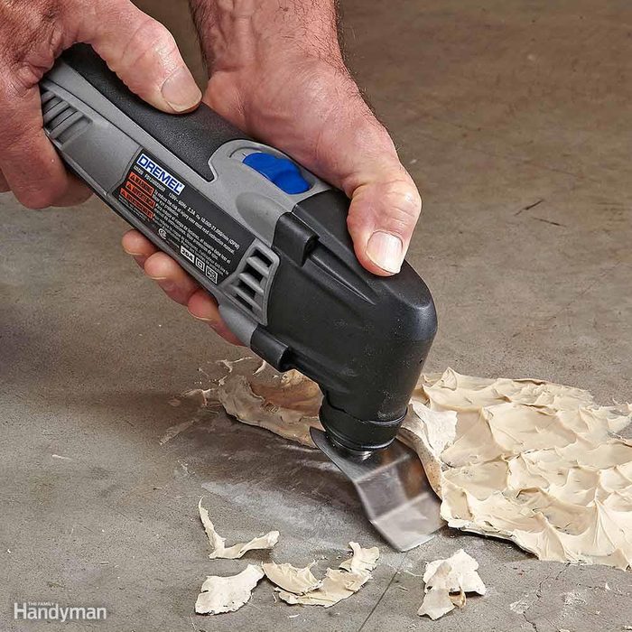 You can use an oscillating tool to remove dried glue and other gunk.