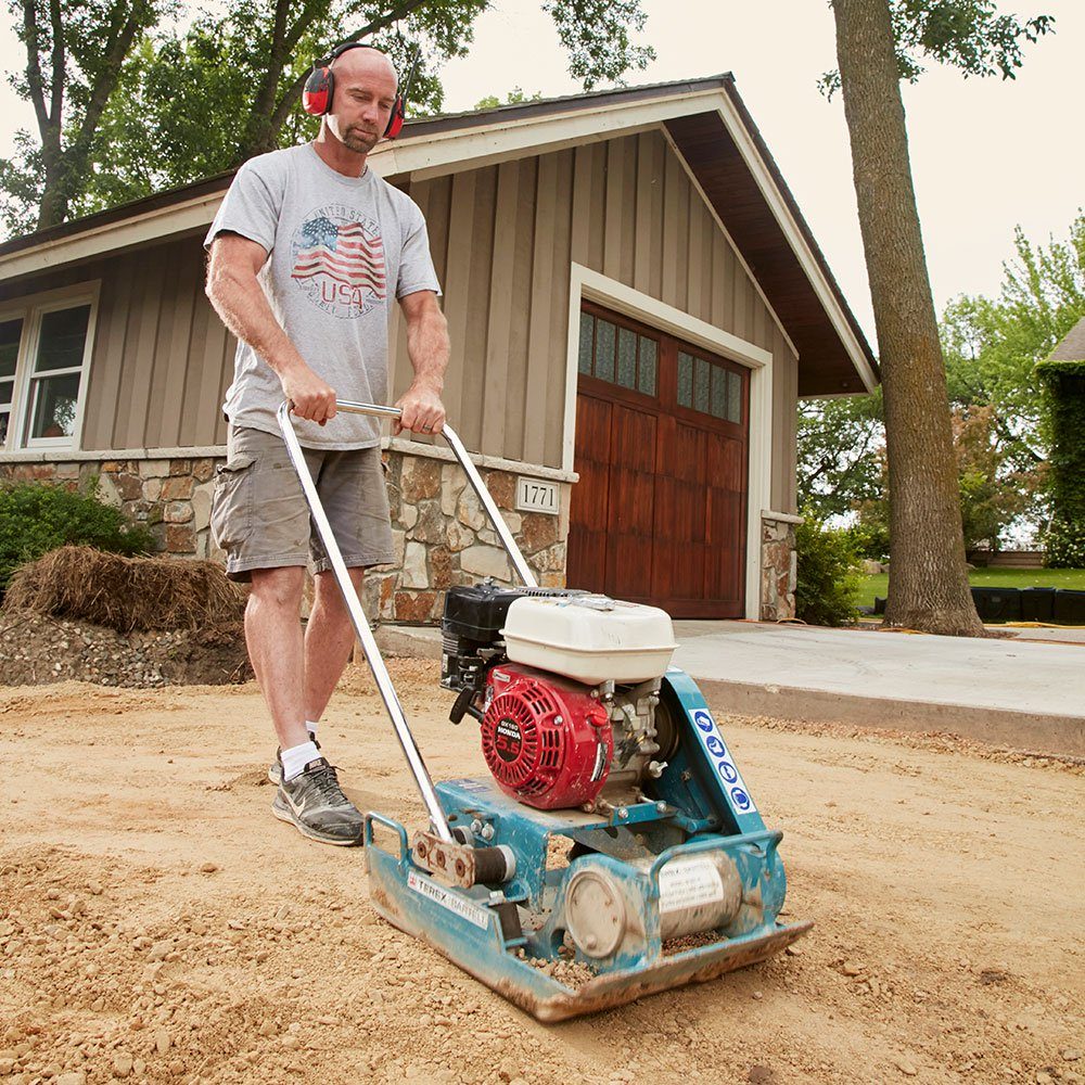 Tamping down the concrete base | Construction Pro Tips