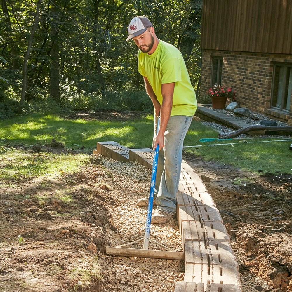 Backfilling the trench with gravel fill | Construction Pro Tips