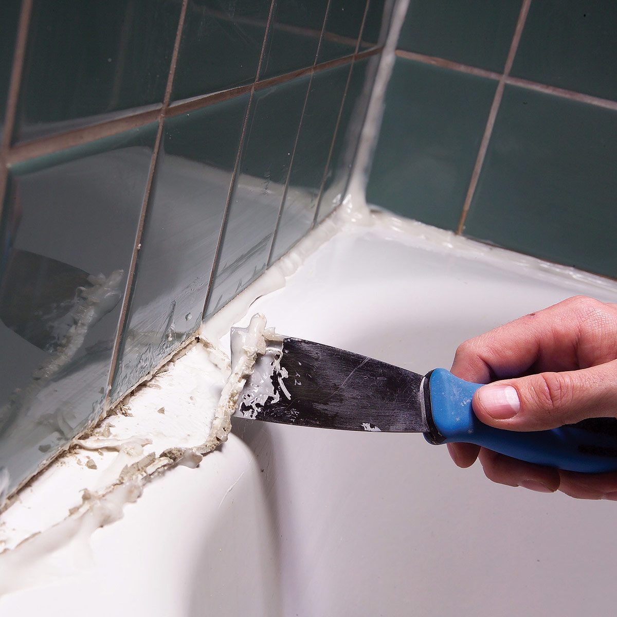 remove caulk from the tub