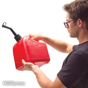 man examines a gas storage container