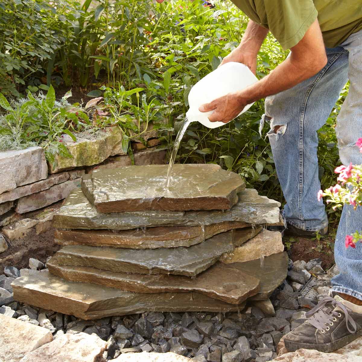 small backyard waterfall pour water