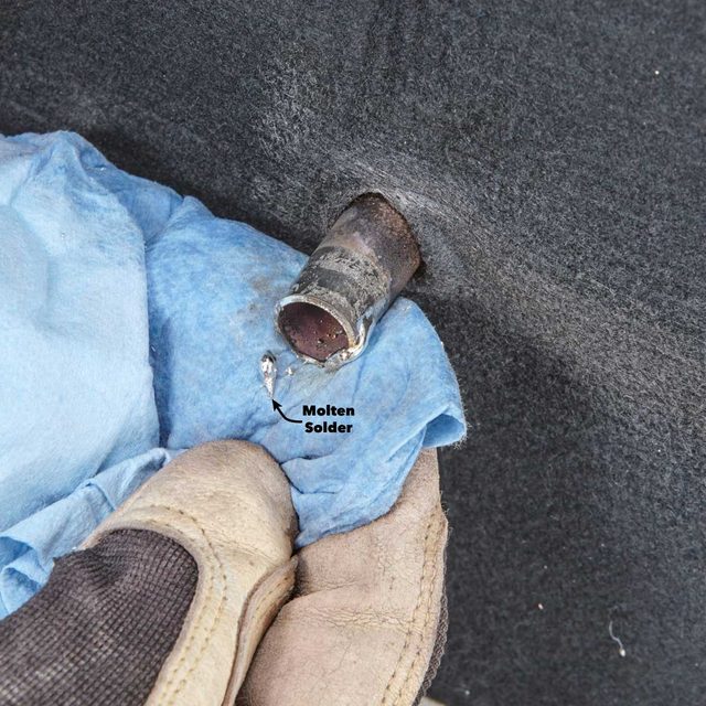 Clean excess solder from valve