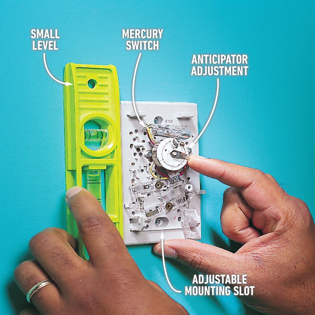 Adjusting mounting slot, anticipator, mercury switch on image of thermostat