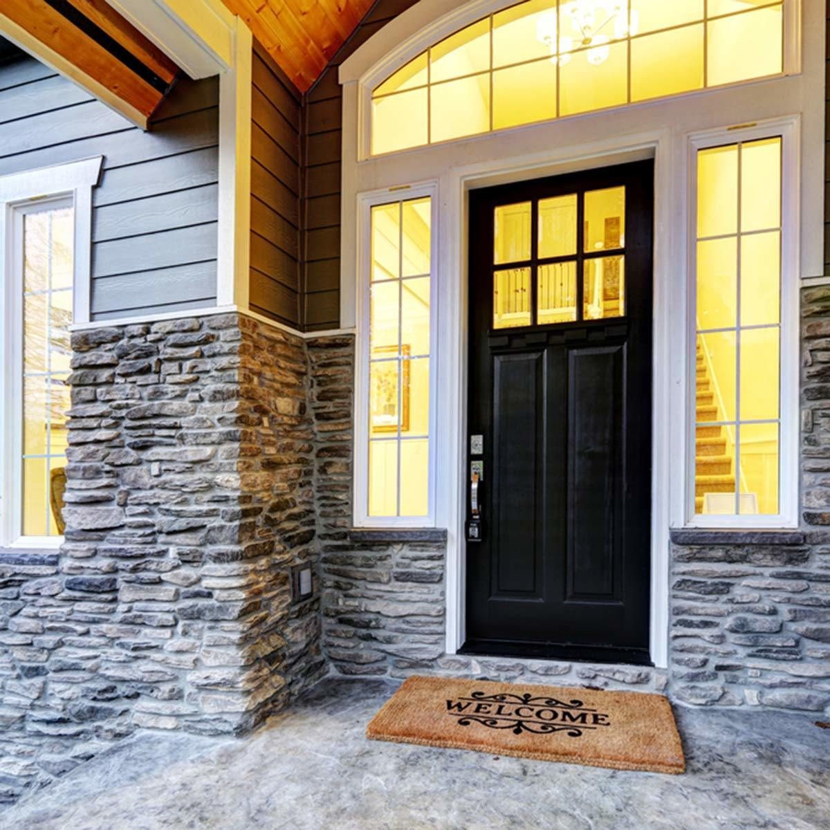 black front door stone work exterior