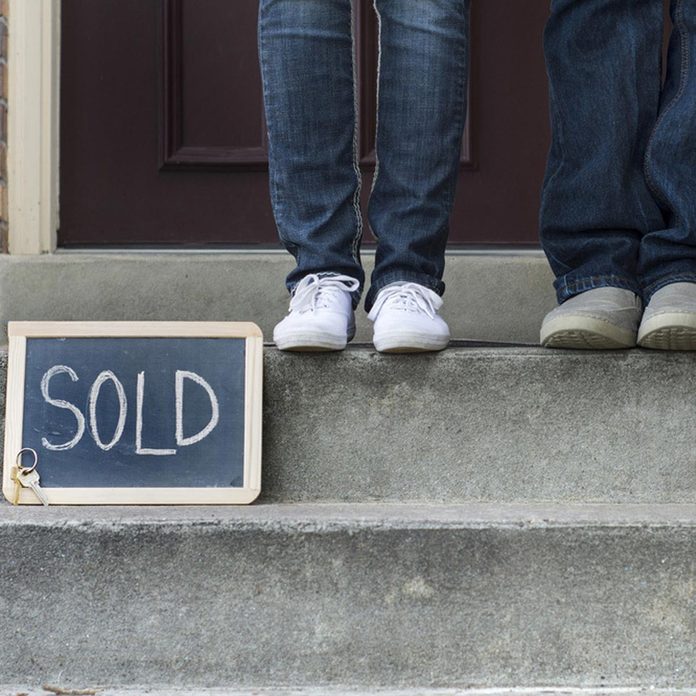 front stoop sold sign house home real-estate