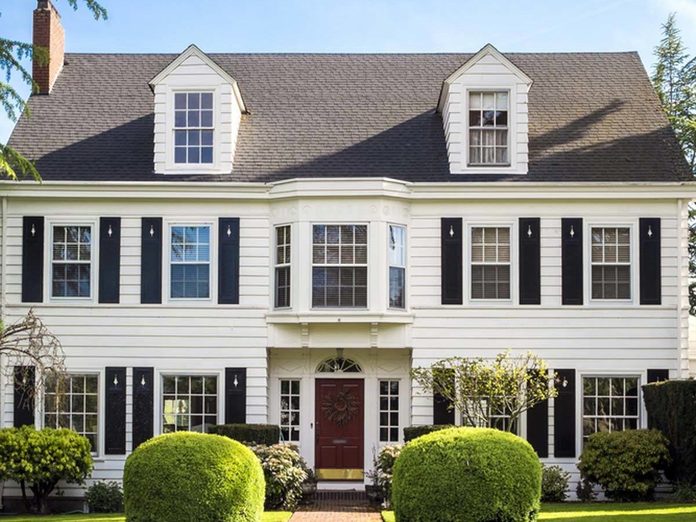 white colonial home house with shutters