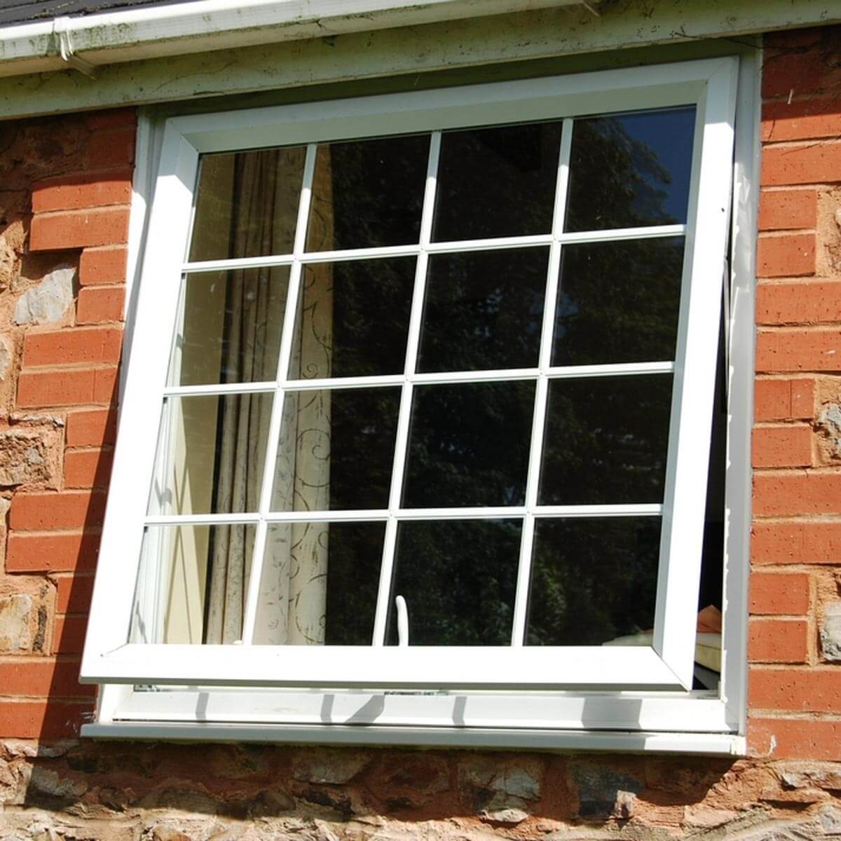 open window on a brick house