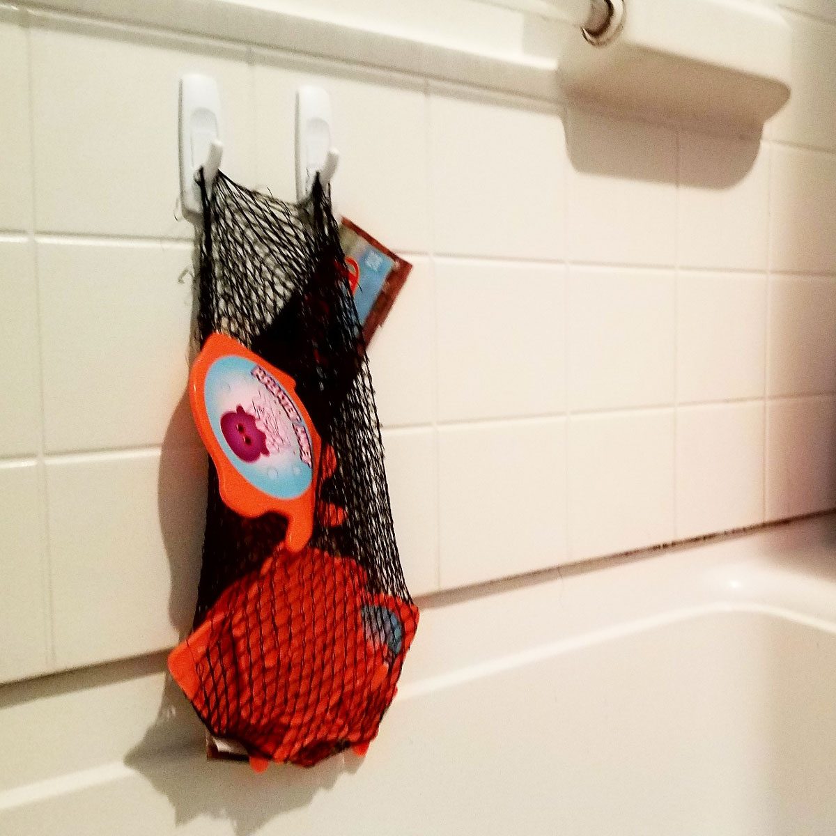 produce-bag bathtub toy storage