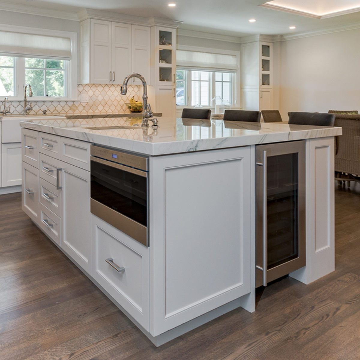 shutterstock_487408141 kitchen island with integrated appliances wine fridge