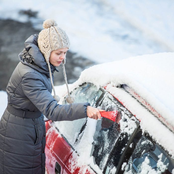 clear-snow_360733841_03 winter driving clearing ice snow off car windows icy roads