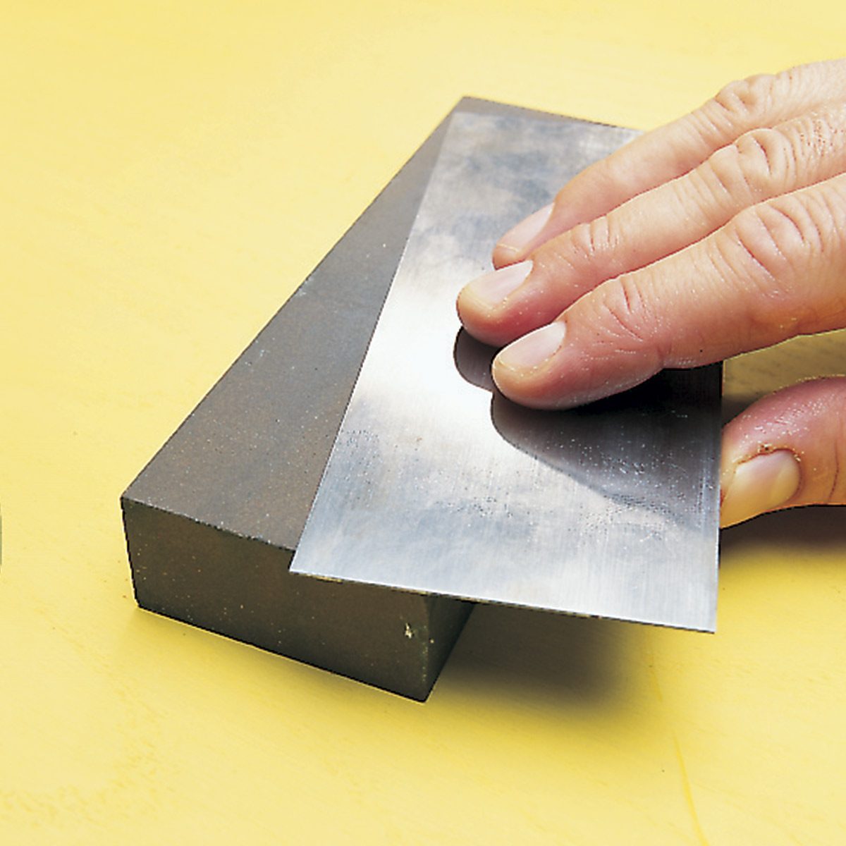 polishing a cabinet scraper