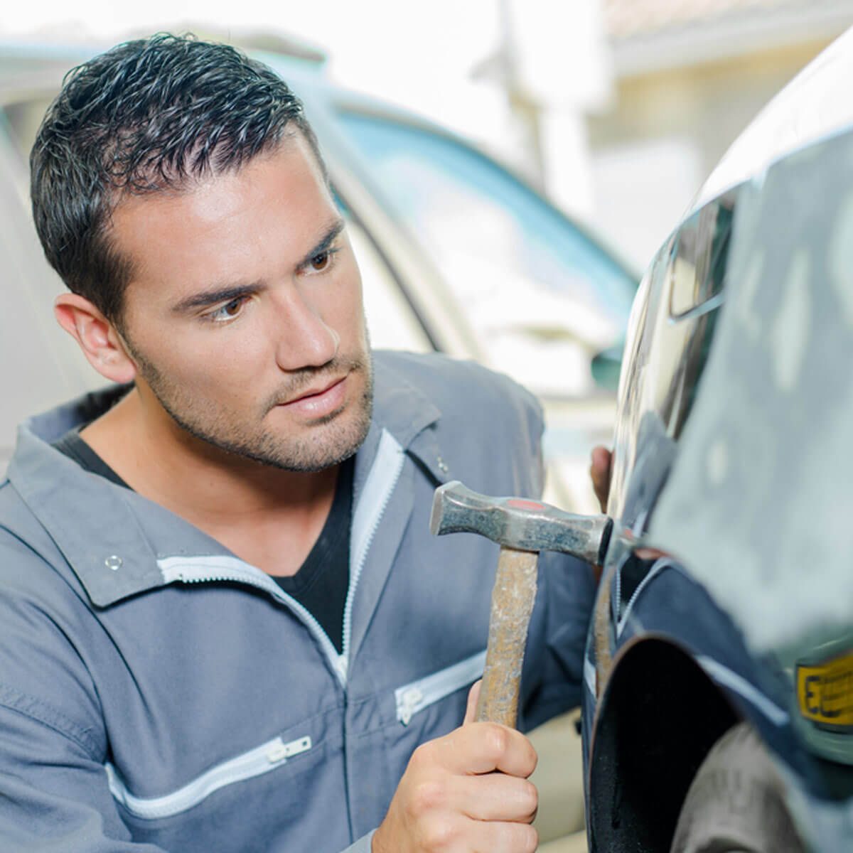 dfh8_shutterstock_277723364 auto mechanic fix car dents