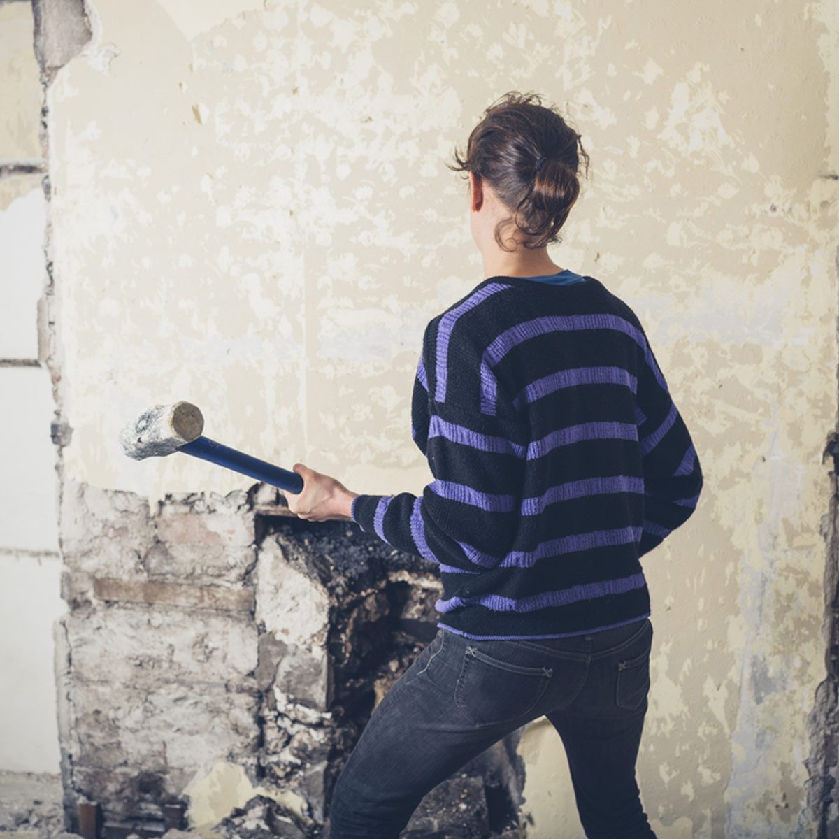 Woman with Sledgehammer Hand Tools for Demolition