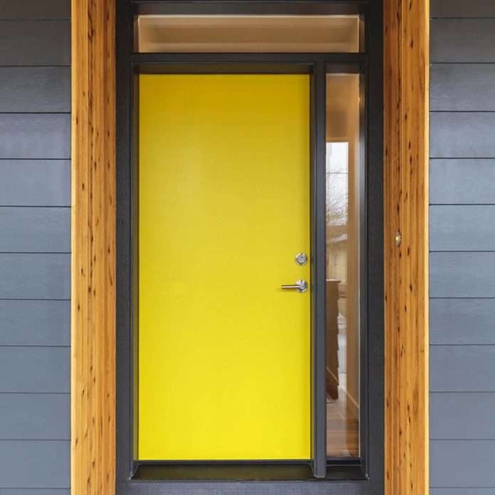 Yellow Front Door with Wood Trim