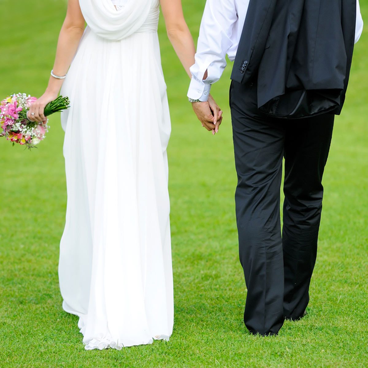 backyard wedding green grass bride and groom