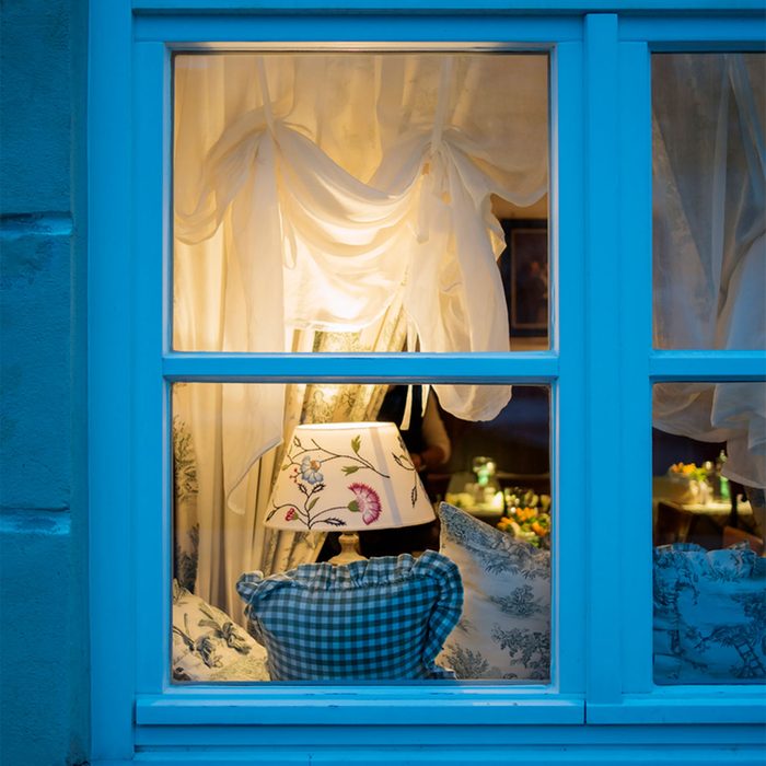 lamp through a window at night