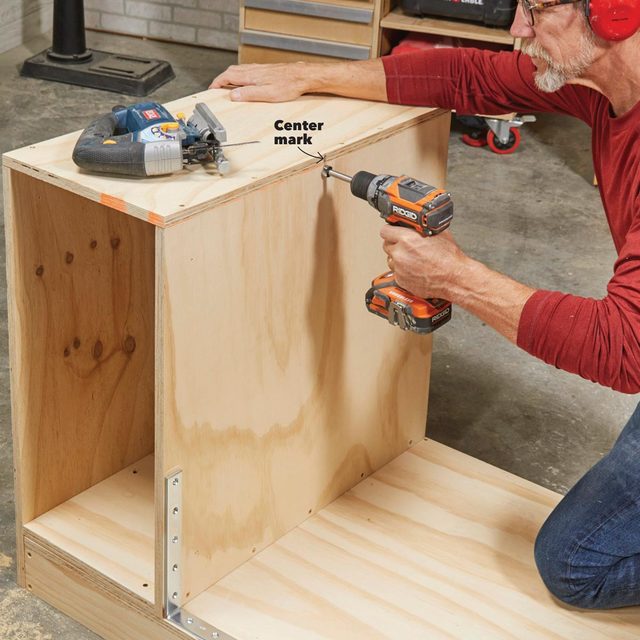 drill the pivot holes in flip-top bench