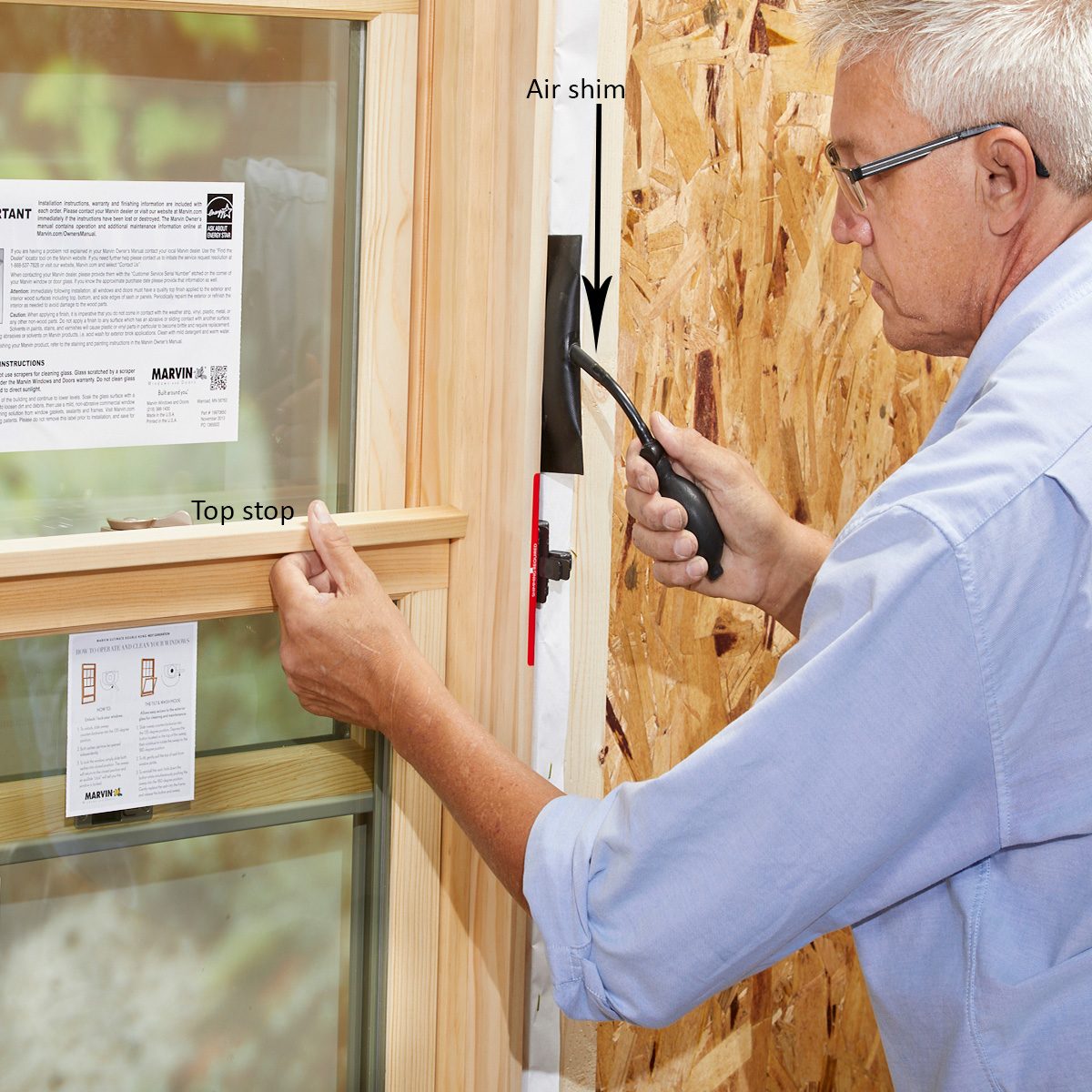 Man using an air shim to install a window | Construction Pro Tips