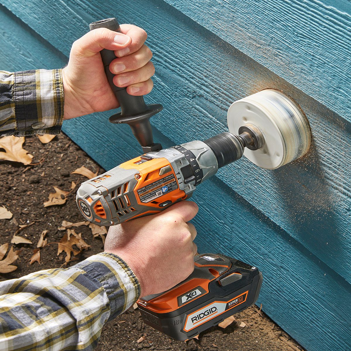 Drilling into siding with a hole saw