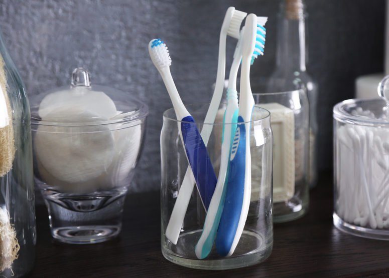 Bath accessories on grey wall background