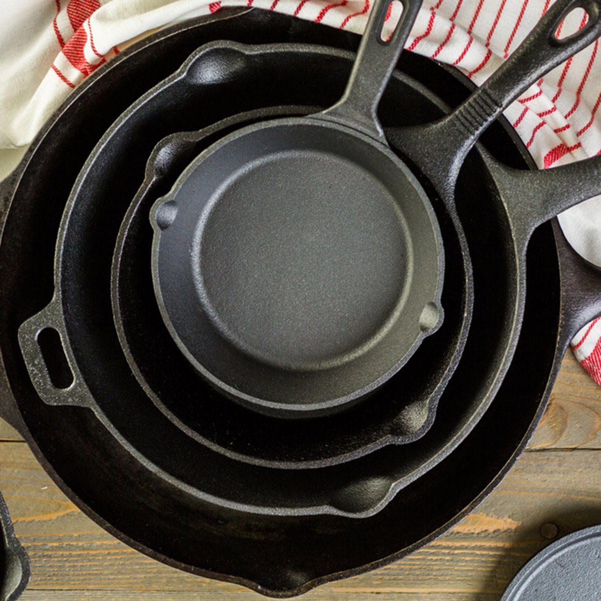 Cast iron skillet on rustic wood table.; Shutterstock ID 370808516