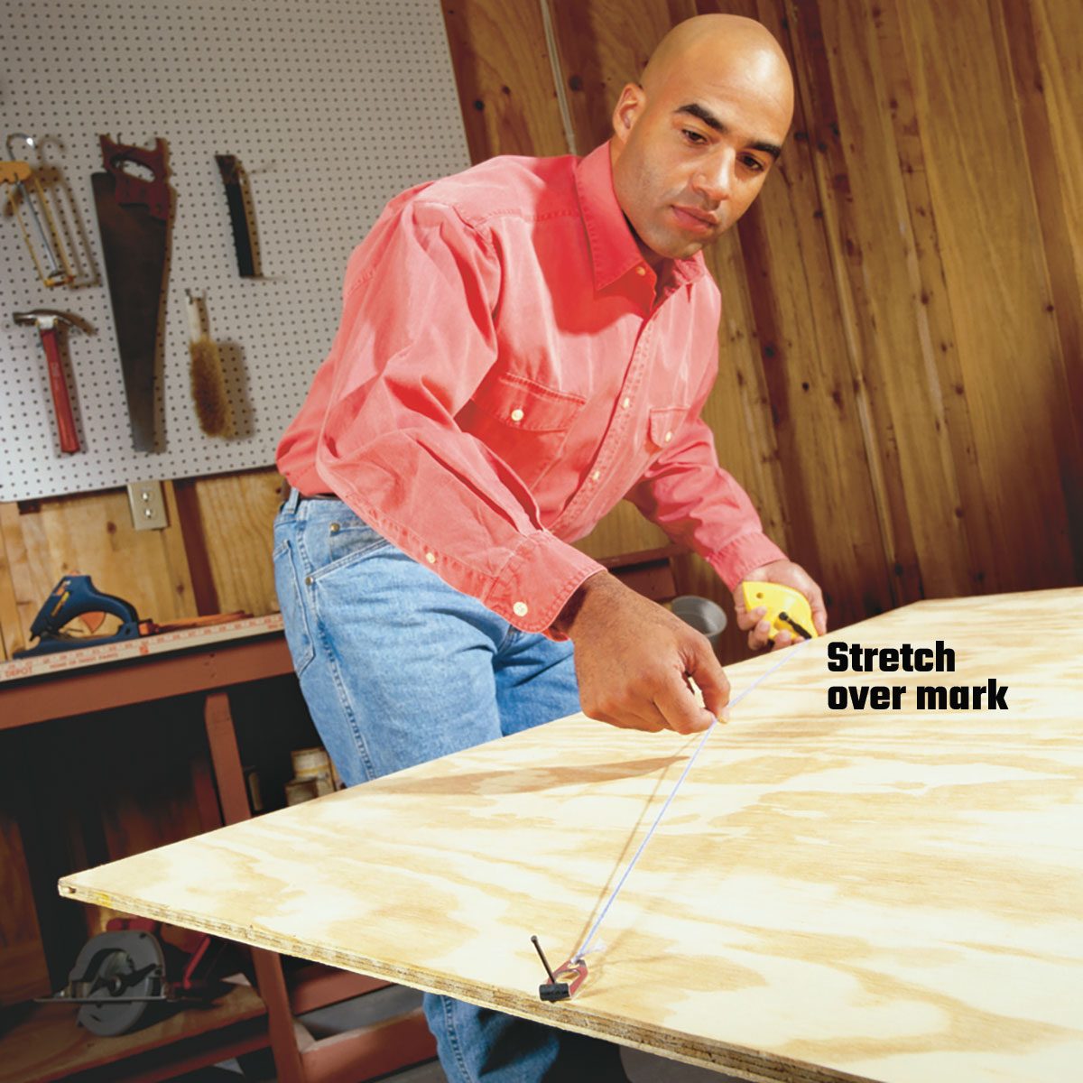 Stretching past a mark to make a line with a chalkline | Construction Pro Tips