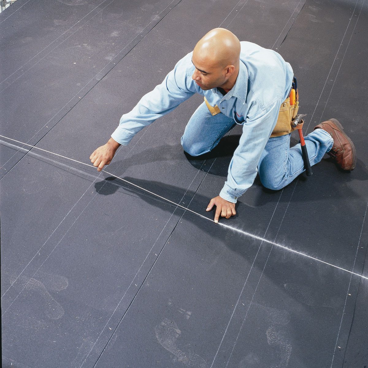 Snapping an extra long line with a chalkline | Construction Pro Tips