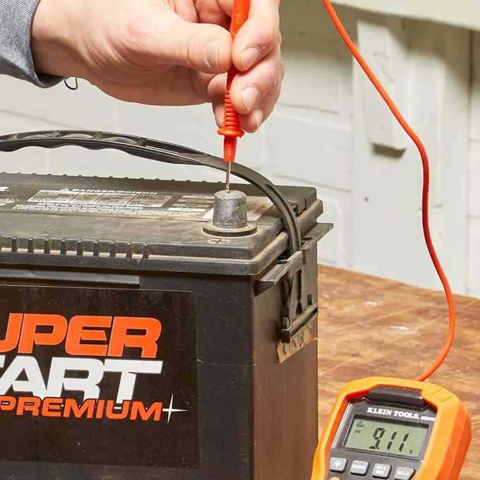 Multimeter Positive Test Lead  Positive test lead probe on battery | Construction Pro Tips