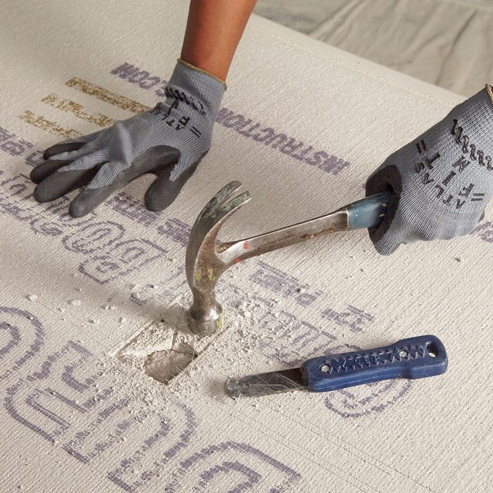 Breaking through an outlet opening with a hammer