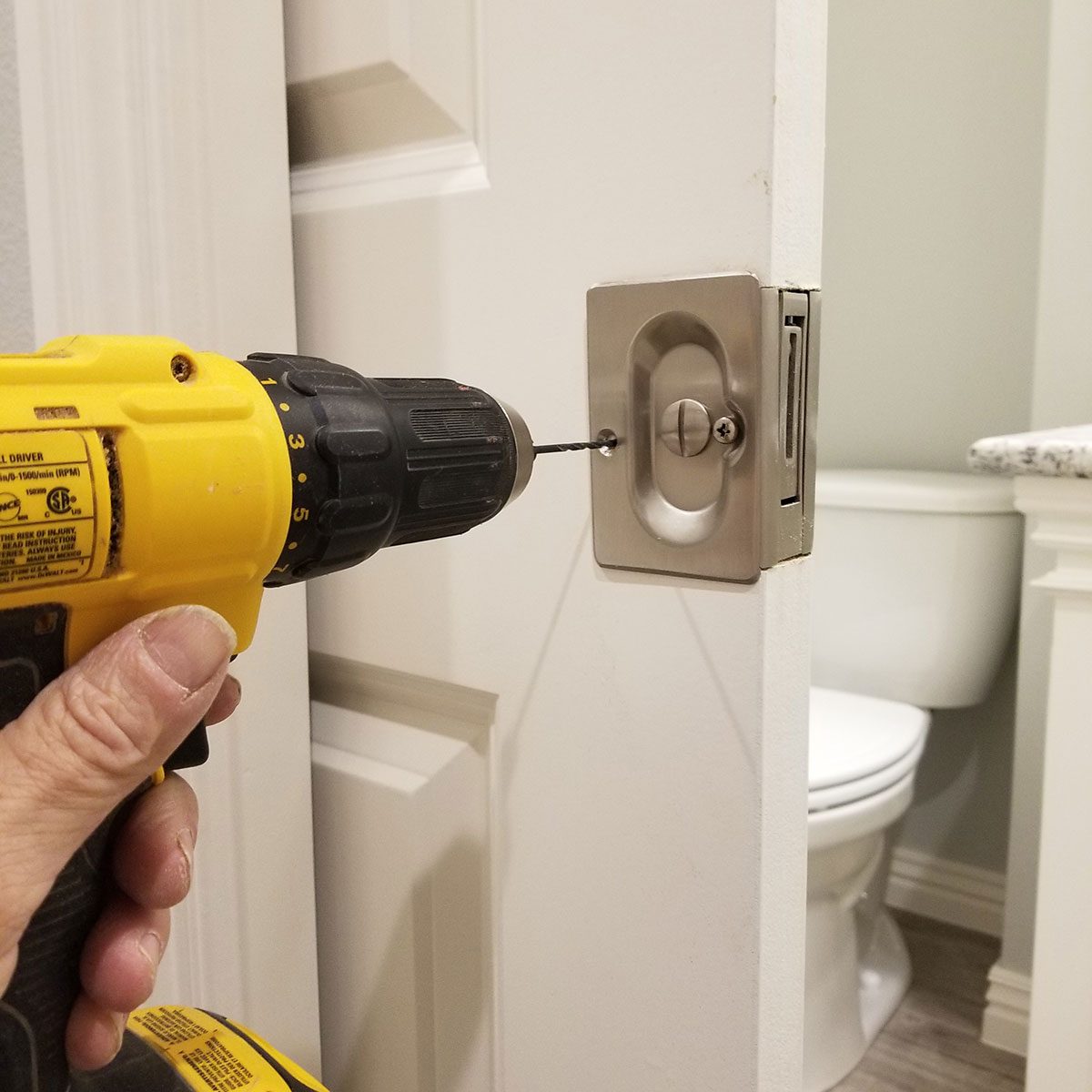 Drilling the hardware into place | Construction Pro Tips