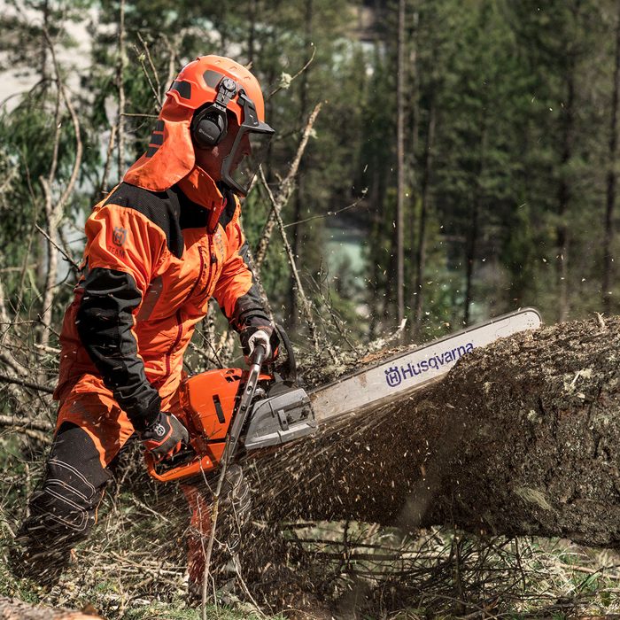 Cutting into a fallen tree with a Husqvarna chainsaw | Construction Pro Tips