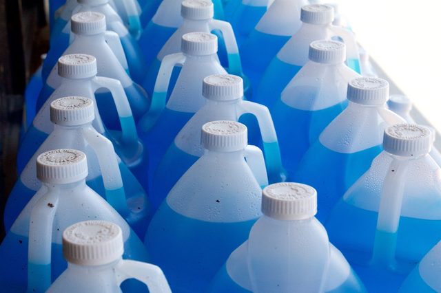 Gallon size jugs of windshield washer fluid sold at a truck stop during.a summer heat wave in central Pennsylvania.