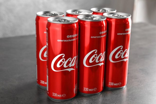 Cans of Coca-Cola on table