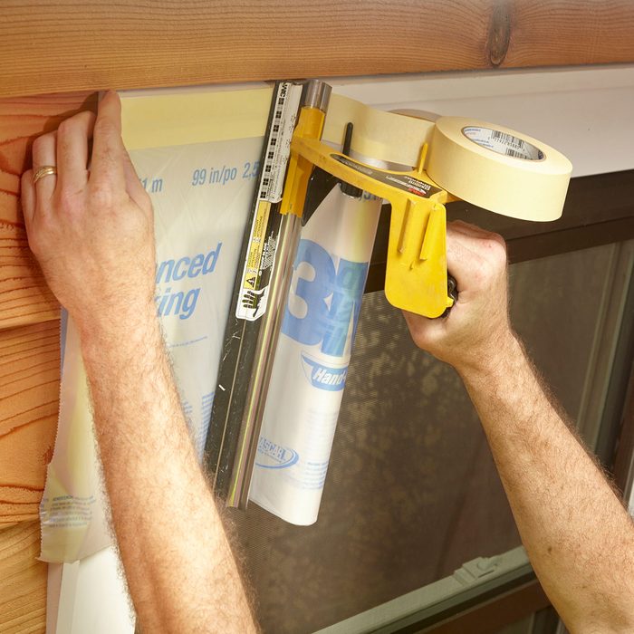 Taping off the frame of a window | Construction Pro Tips