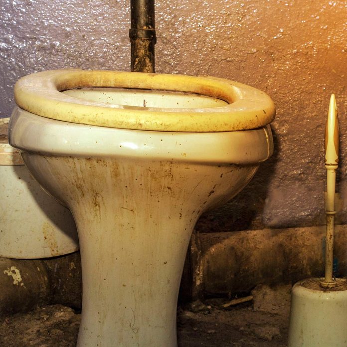 Dirty-unhygienic-toilet-bowl-with-limescale-stain-at-public-restroom