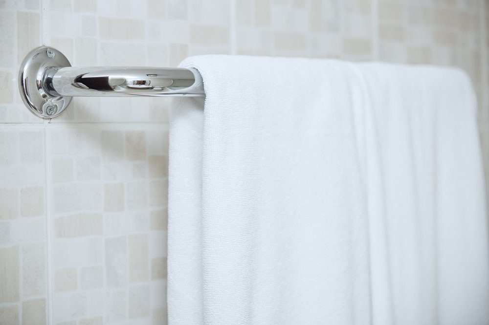 Towel drying on the rail in bathroom