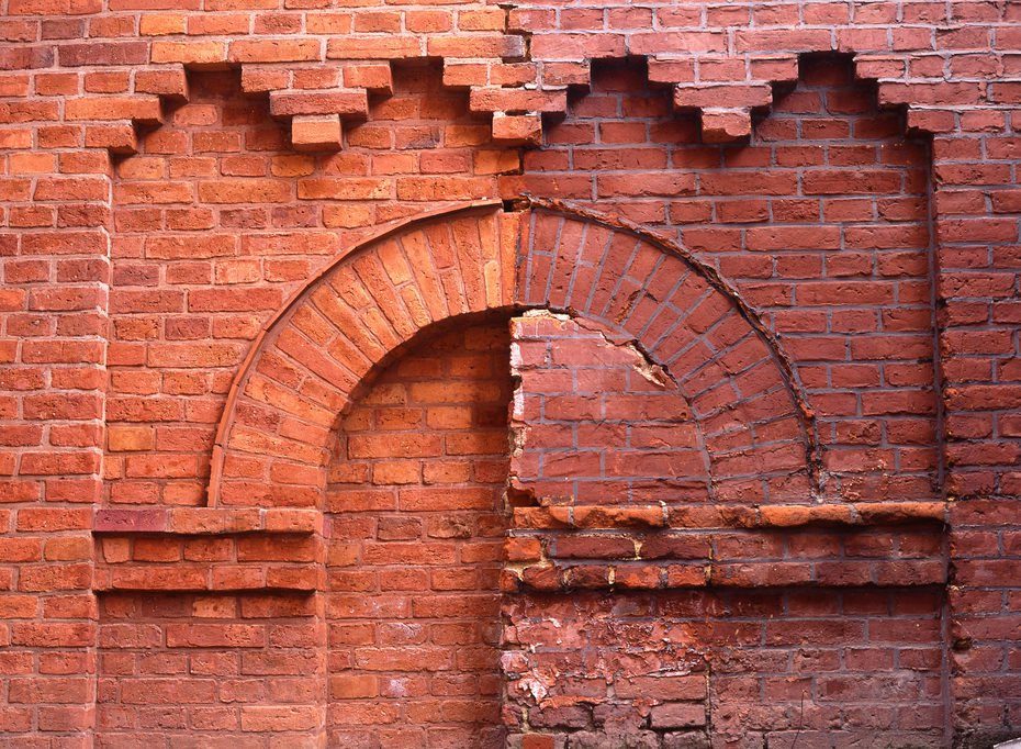 brick wall, with clean and dirty bricks