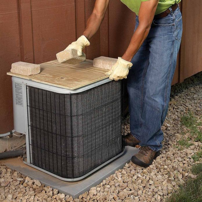 winterize ac unit with plywood protector