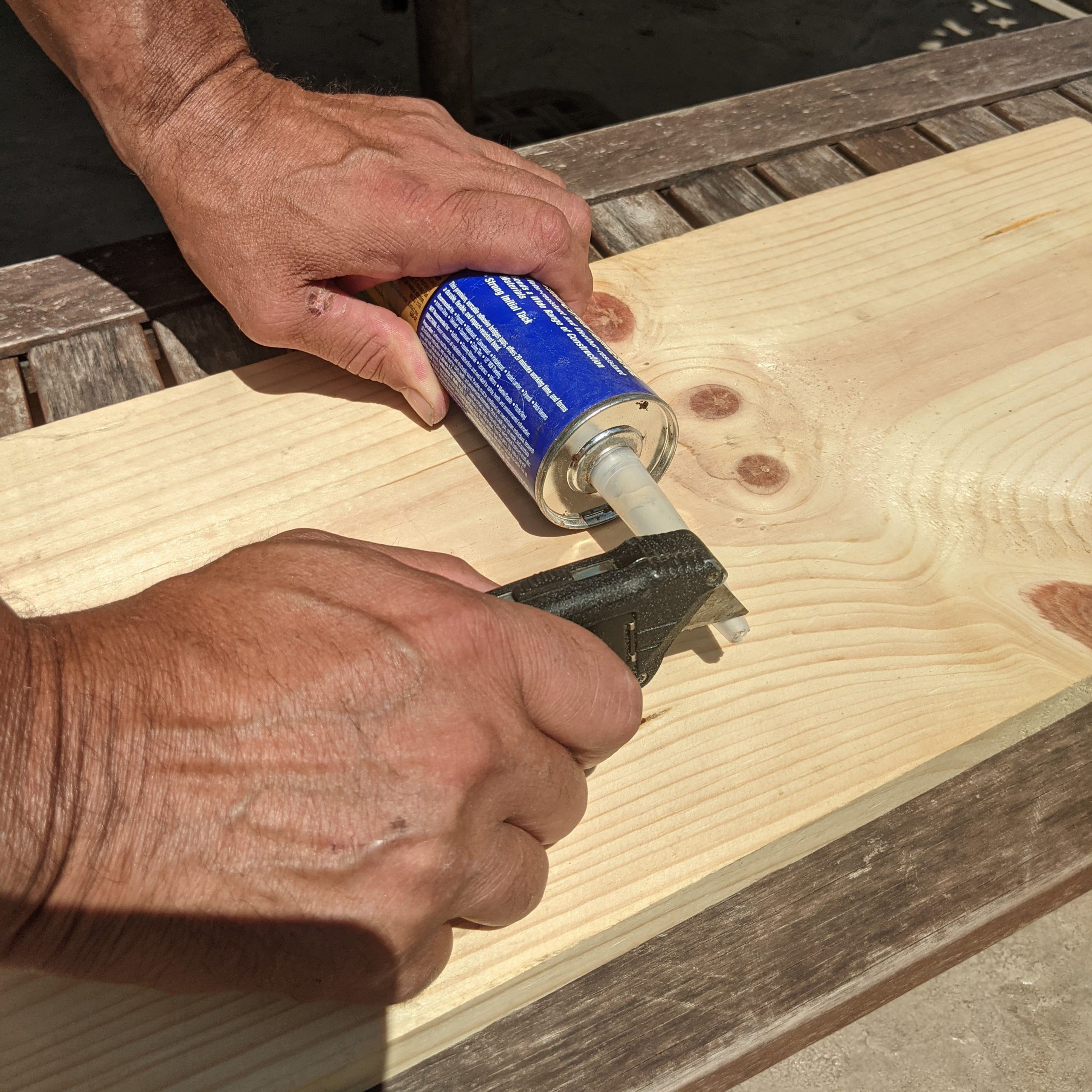 Cutting a tube of caulk