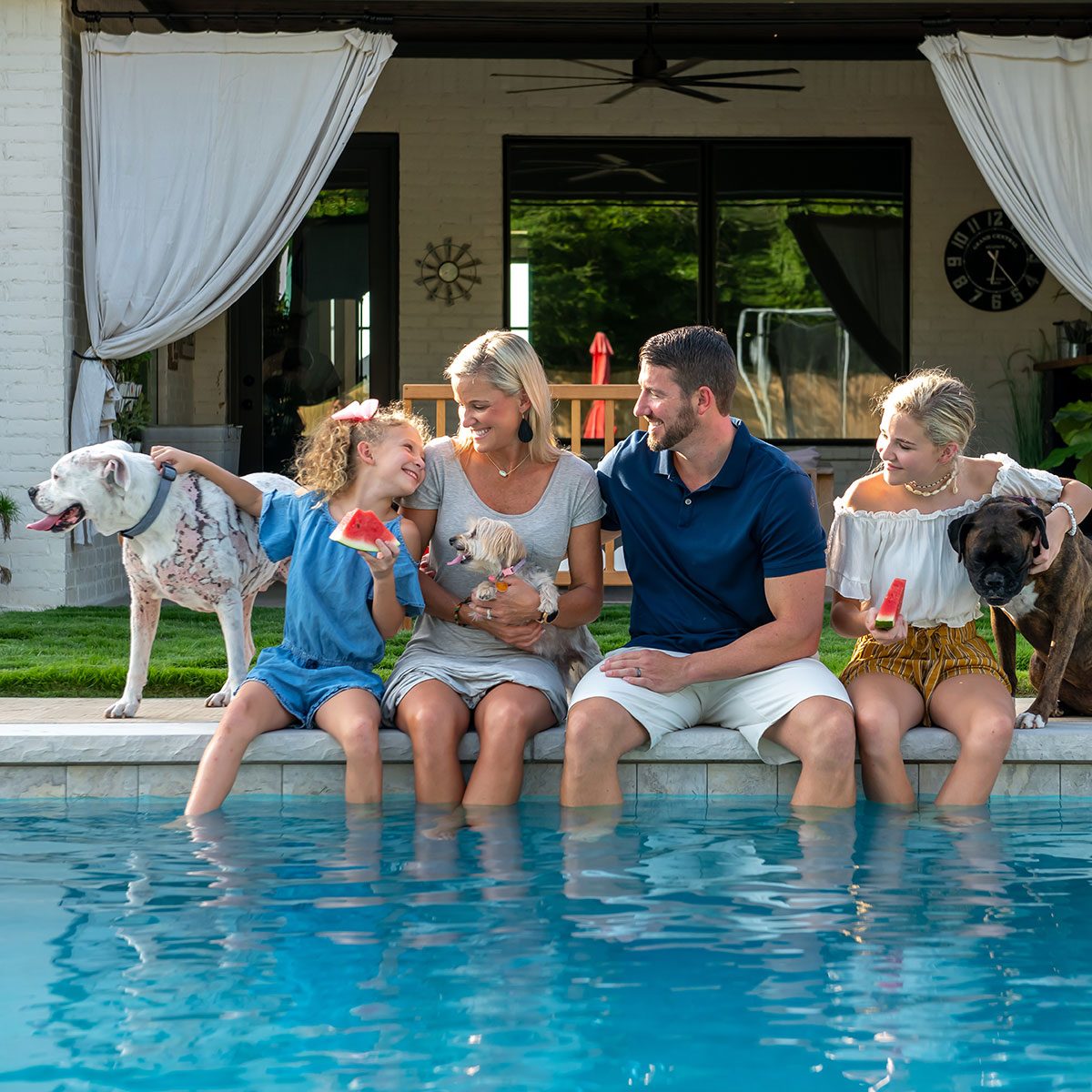 Family enjoying themselves by the pool