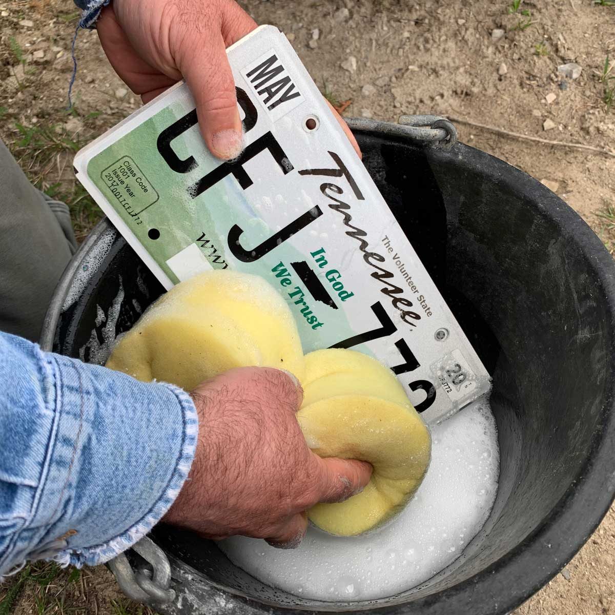 Cleaning a license plate