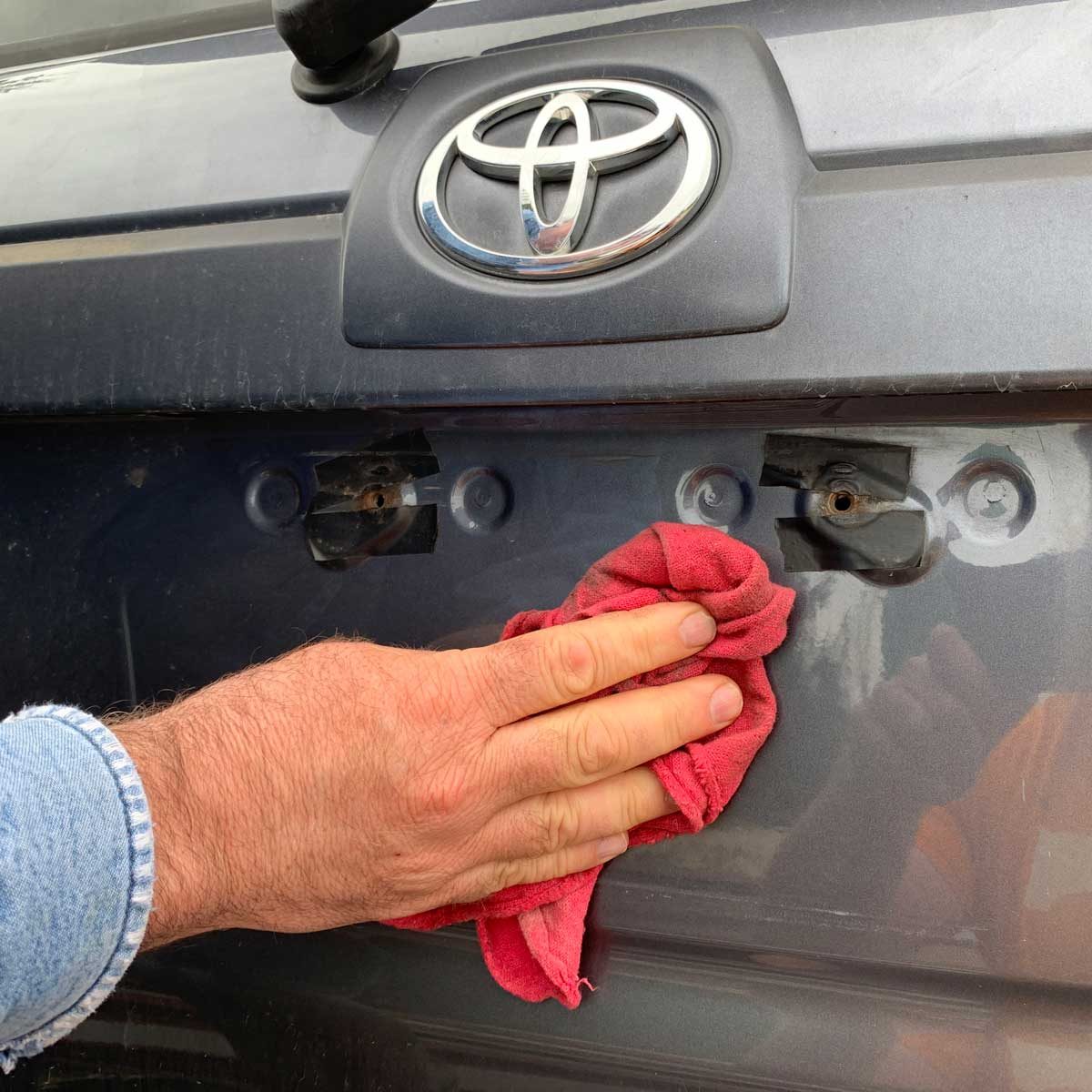 Cleaning a license plate