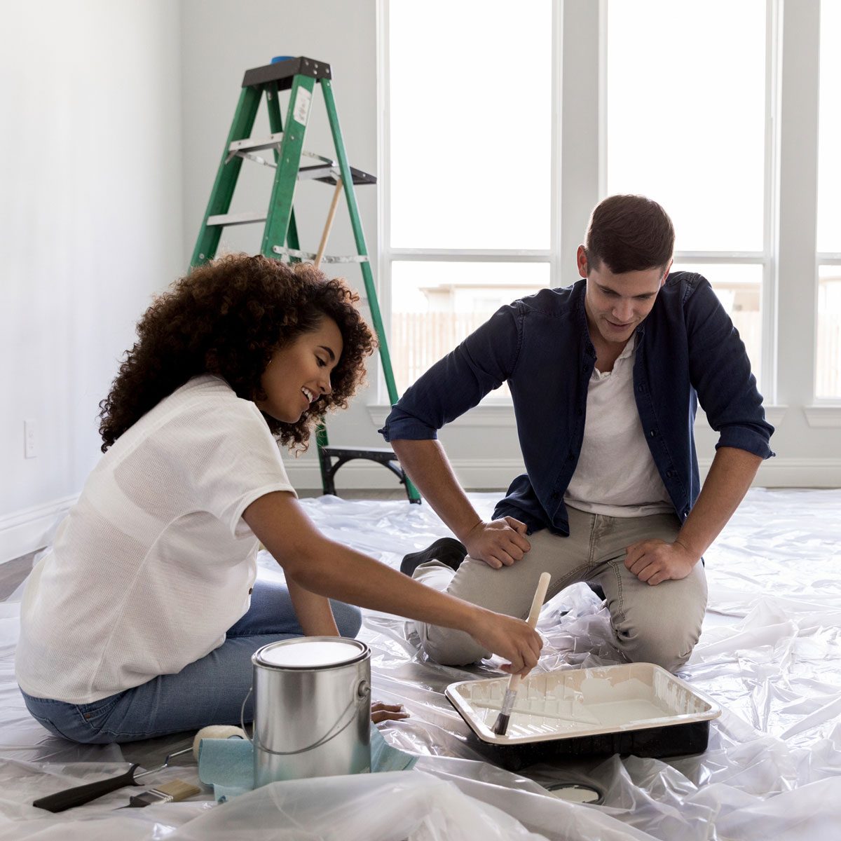 Couple painting their home