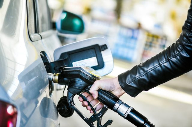 Refueling car at gas station. Filling fuel.