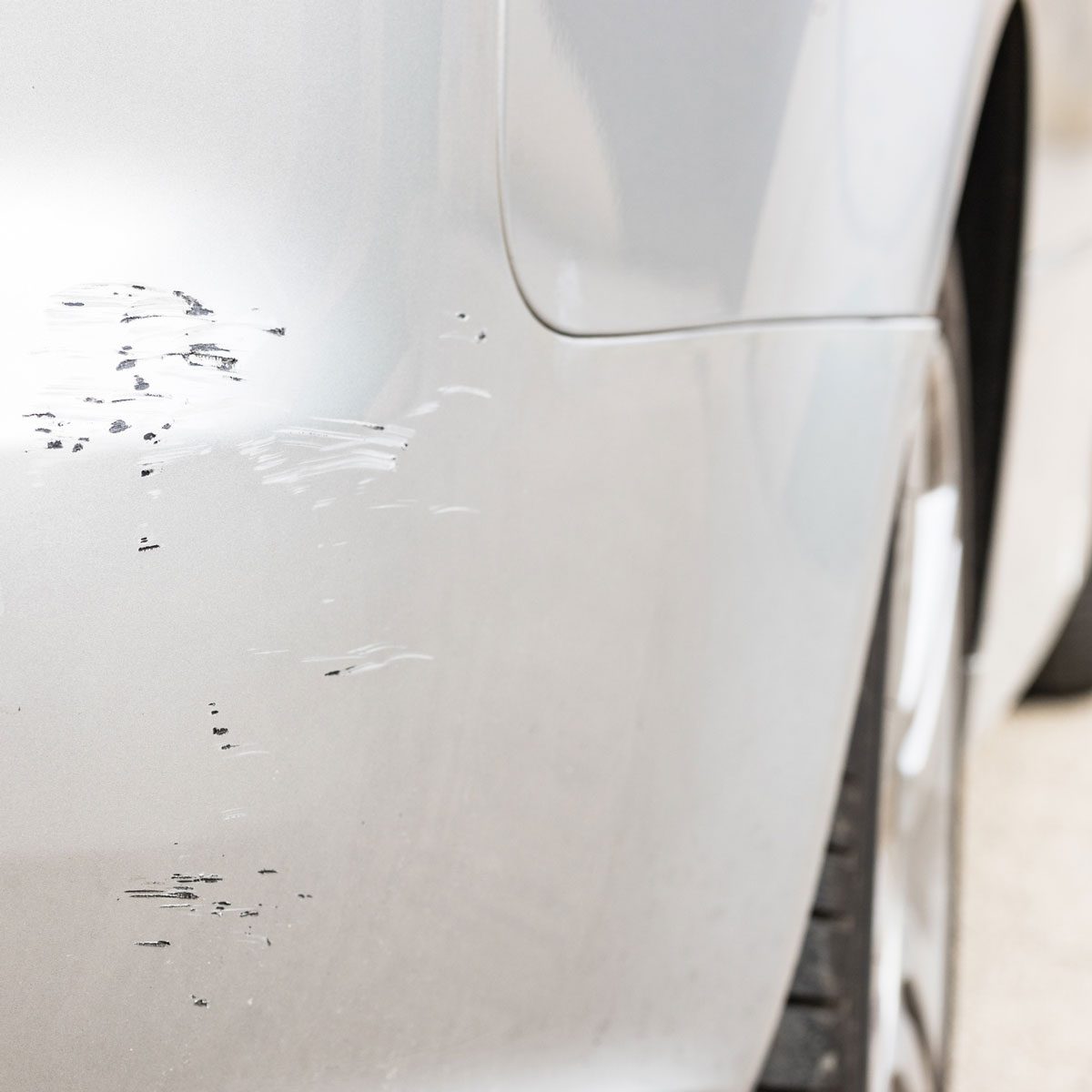 Chipped paint on a white car