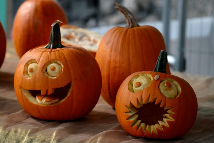 Pumpkins decorated with faces with eyes and mouths