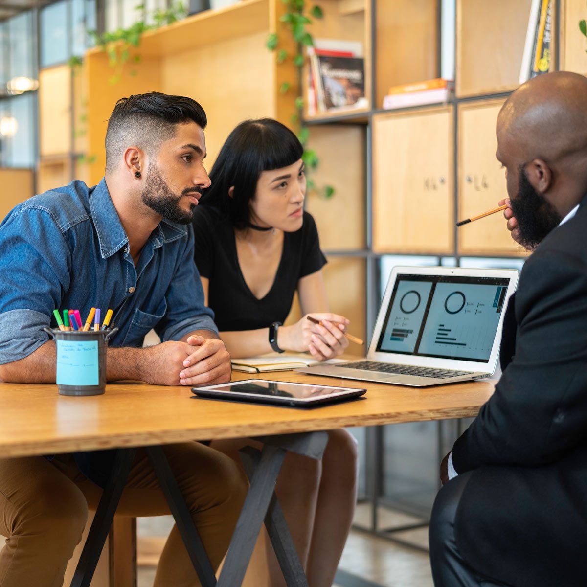 Agent talking to a couple in the office