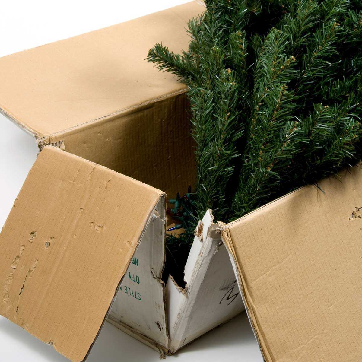 Artificial Christmas tree in an old box